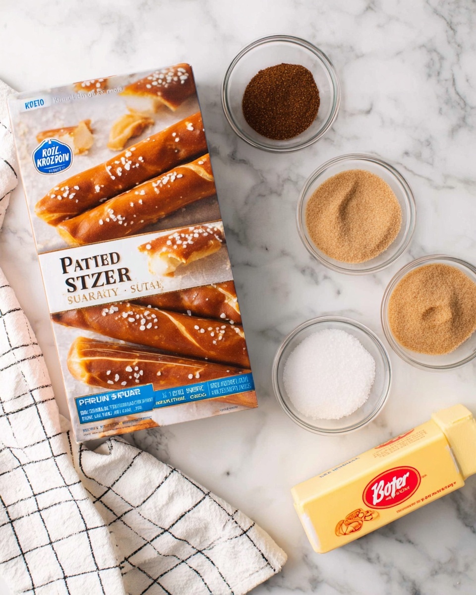 A box of Kroger Bavarian Style Soft Pretzel Sticks is placed on a white marbled surface. The box shows pictures of the brown pretzel sticks topped with coarse salt and small slits on top. Around the box, there are three small clear glass bowls with powders: one has dark brown powder, another has white granulated powder, and the third contains light brown sugar. Near them, there is a stick of yellow butter with red text. A white towel with black grid lines lies partially under the box on the left side. photo taken with an iphone --ar 4:5 --v 7