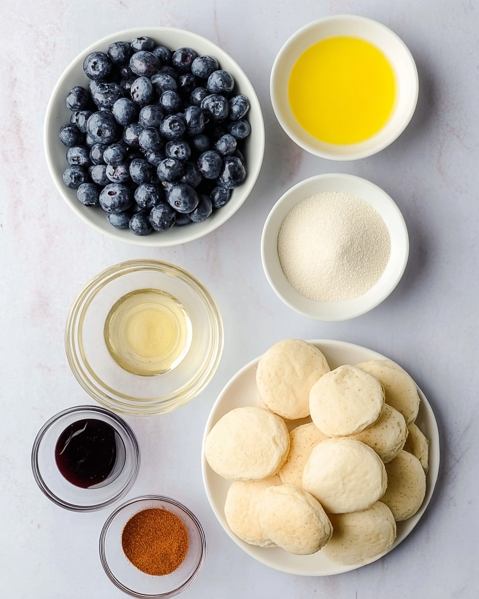 The image shows an arrangement of small white bowls and a white plate on a white marbled surface. In the top left corner, there is a white bowl filled with fresh, plump blueberries, deep blue in color with a slightly matte texture. To the right of the blueberries, a white bowl holds a bright yellow liquid, smooth and shiny. Below this, a small clear glass bowl holds a pale golden liquid, translucent with a glossy surface. To its right, another white bowl is filled with fine white granules. Below the blueberries, a white bowl contains light brown soft sugar clumps with a crumbly texture. At the bottom left, two small clear glass bowls hold dark brown liquid and reddish-brown powder, both with smooth textures. On the bottom right side, a large white plate is piled with soft, pale biscuits round in shape with a slightly uneven surface. The photo taken with an iphone --ar 4:5 --v 7