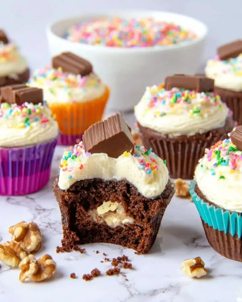 Cream Cheese Filled Chocolate Cupcakes with Peanut Butter Cups and Rolo Toppers Recipe