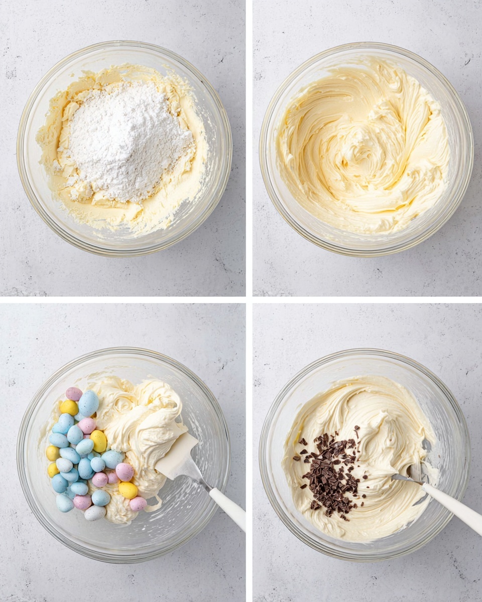 No-Bake Mini Egg Cheesecake Recipe 5 A clear glass bowl placed on a white marbled surface shows four stages of mixing a creamy batter. The first stage has pale yellow batter with a mound of white powder on top. The second stage shows the batter smoothly mixed into a light cream color with swirls. The third stage reveals a white spatula folding in a fluffy white layer into the creamy base, creating soft texture contrast. The fourth stage contains the creamy batter mixed with colorful mini candy eggs in pastel blue, pink, and yellow, along with small chocolate pieces scattered on top. Photo taken with an iphone --ar 4:5 --v 7