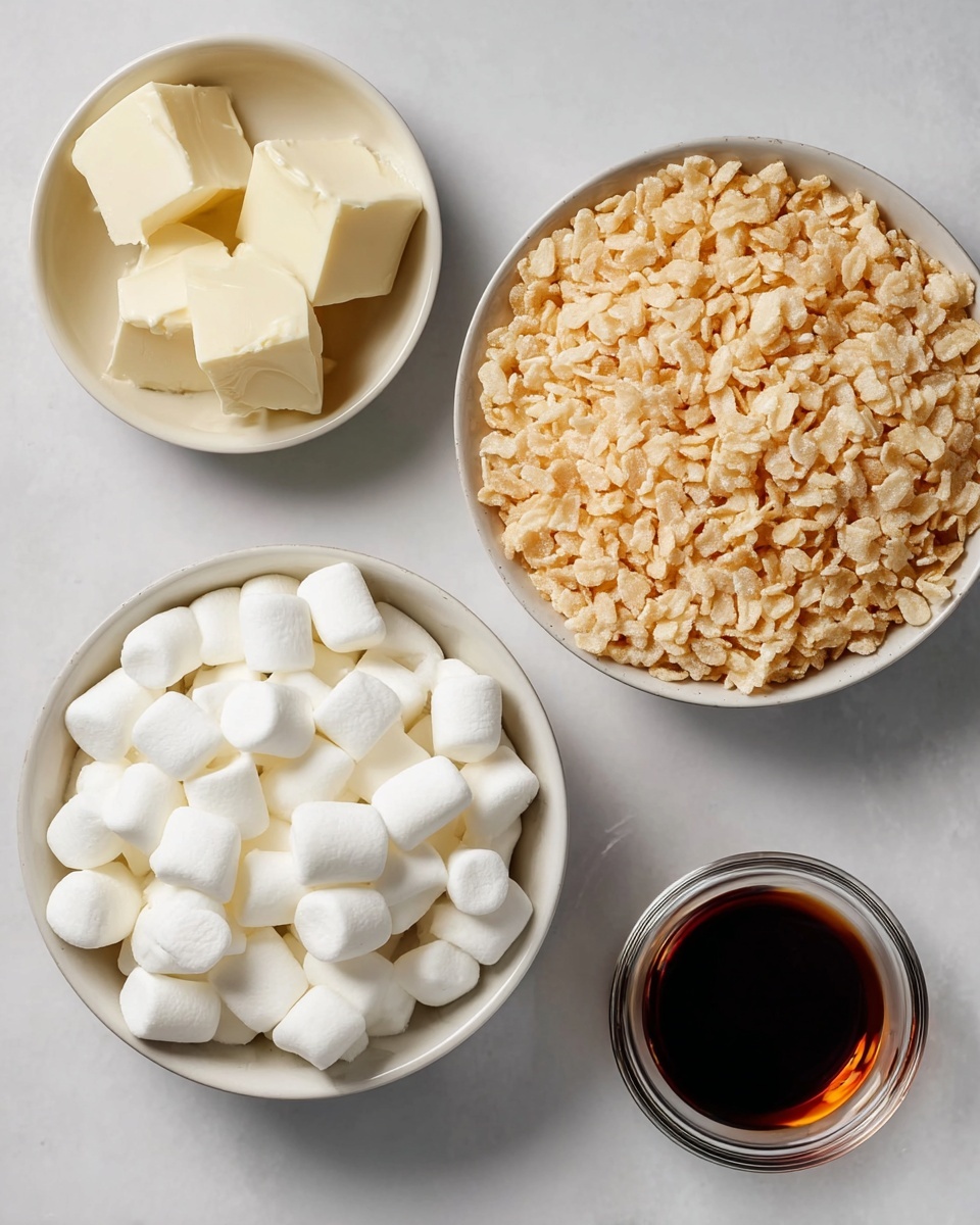 The image shows four separate bowls arranged on a white marbled surface. The top right bowl is filled with light tan crispy rice cereal with a bumpy texture. Below it to the left, there is a bowl full of small, white, soft-looking marshmallows, smooth and rounded. At the top left, a small bowl holds chunks of creamy white butter with a smooth and slightly uneven surface. Finally, to the bottom right, a clear small glass bowl contains a dark brown liquid, likely vanilla extract, with a glossy surface. All bowls are white, and the overall layout is neat and simple. Photo taken with an iphone --ar 4:5 --v 7