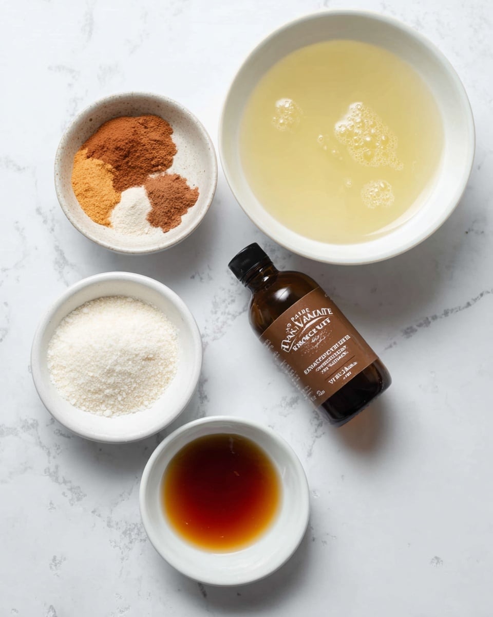 The image shows four white bowls and a small brown bottle arranged on a white marbled surface. The largest bowl on the right contains a pale yellow liquid with a smooth surface and a few bubbles. Above the bottle, a medium-sized bowl holds a mix of brown and orange powders with a slightly coarse texture. Below it, another medium bowl is filled with white granular powder. To the far right, a small white bowl holds a dark amber liquid that appears thick and shiny. The brown bottle labeled