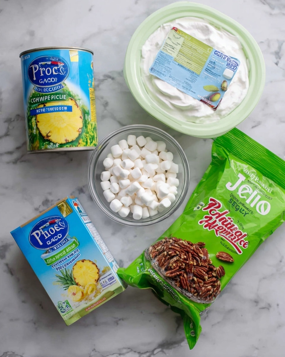 The image shows five baking ingredients placed on a white marbled surface. There is a can of crushed pineapple with a blue and green label, a box of pistachio Jello in light green packaging, a large white container of whipped topping with a blue label, a green bag of chopped pecans with a clear window showing the nuts inside, and a small clear glass bowl filled with white mini marshmallows. The items are spaced out and arranged casually with no overlapping. photo taken with an iphone --ar 4:5 --v 7