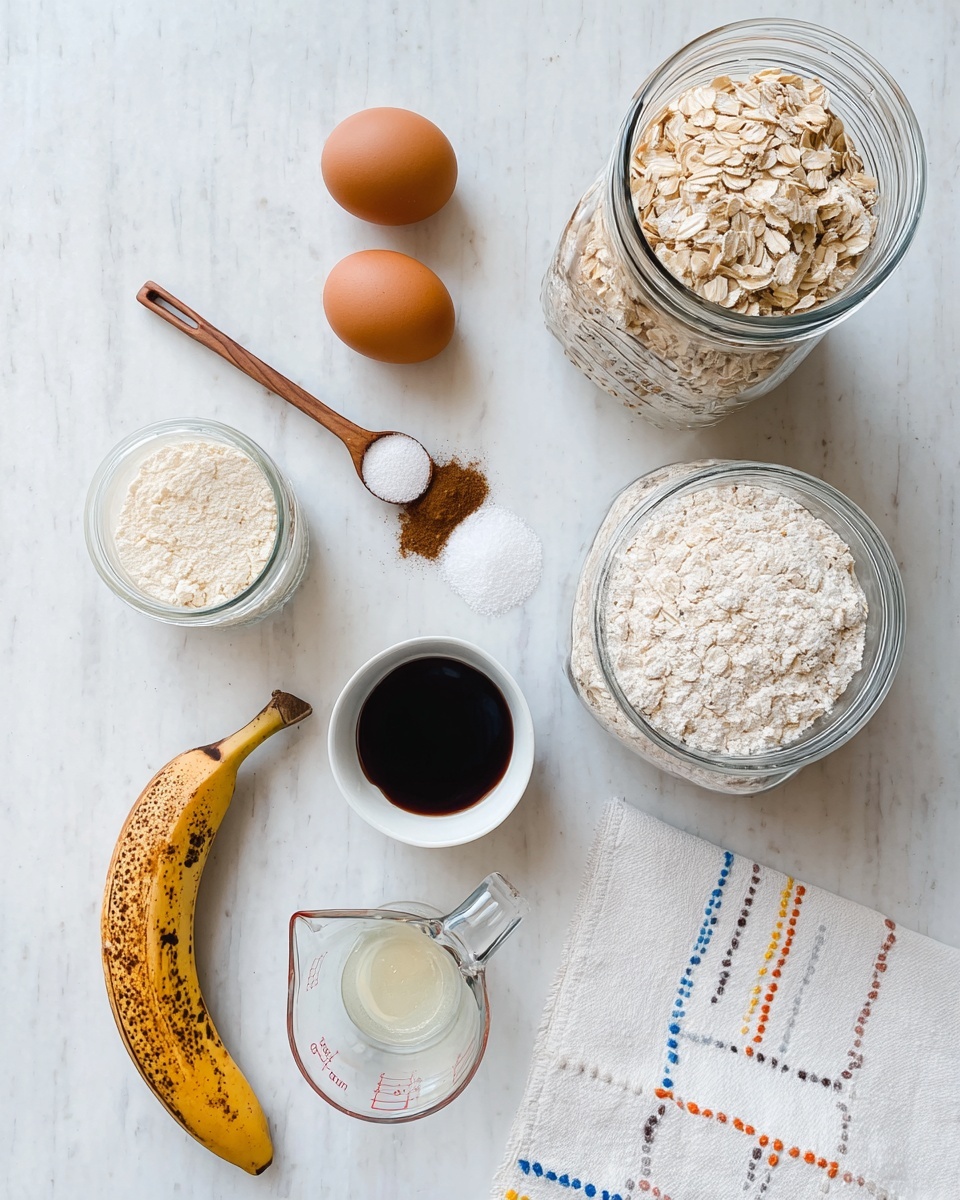 The image shows several baking ingredients arranged neatly on a white marbled surface. There is a large glass jar filled with rolled oats on the top right and another large glass jar with light-colored flour crushed into small chunks near it. Two brown eggs are placed next to a small wooden spoon holding salt and a measuring spoon filled with ground cinnamon. Below them, there is a ripe banana with brown spots on its peel, a small white bowl filled with dark vanilla extract, and a clear glass measuring cup with a creamy liquid. A white cloth with dotted stitching in blue, orange, and yellow lies on the bottom right corner. Photo taken with an iphone --ar 4:5 --v 7
