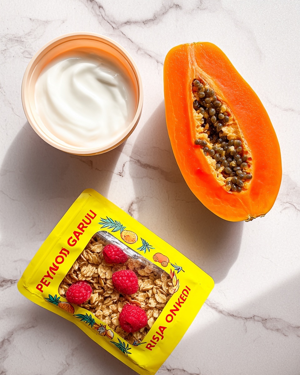 A fresh orange papaya half with bright orange flesh sits on a white marbled surface next to a white container filled with smooth, creamy, all-white Greek yogurt. Next to them is a bright yellow bag of granola with colorful tropical fruit illustrations and red text, showing clusters of granola with dried raspberries inside a clear window on the front. The scene is lit naturally and appears simple and fresh with the items spaced apart on the white marbled texture. photo taken with an iphone --ar 4:5 --v 7