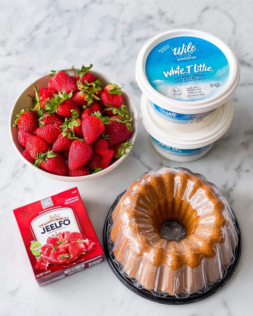 The image shows a white bowl filled with bright red strawberries with green leaves on top, sitting on a white marbled surface. Next to the bowl are two white containers stacked, labeled