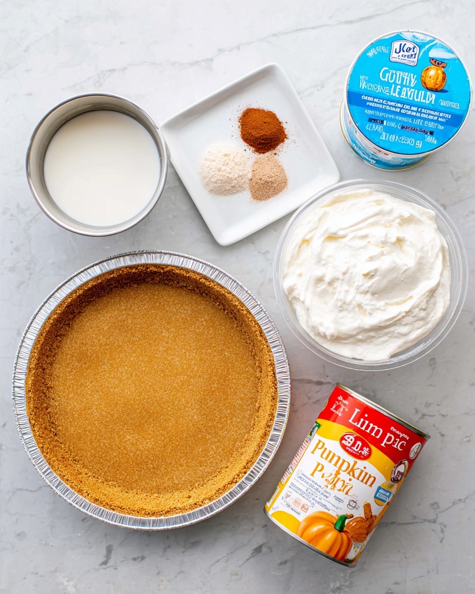 The image shows five baking ingredients neatly arranged on a white marbled surface: a round graham cracker pie crust with a golden brown texture in a foil pie pan at the bottom left, a small metal cup filled with white milk to the upper left of the pie crust, a white square dish holding a small pile of brown cinnamon powder near the top center, a large white round container of whipped topping with a bright blue label in the top right, and a small orange can of pumpkin with a white label and a picture of pumpkin pie at the bottom right. The items are clean, brightly lit, and spaced evenly. Photo taken with an iphone --ar 4:5 --v 7