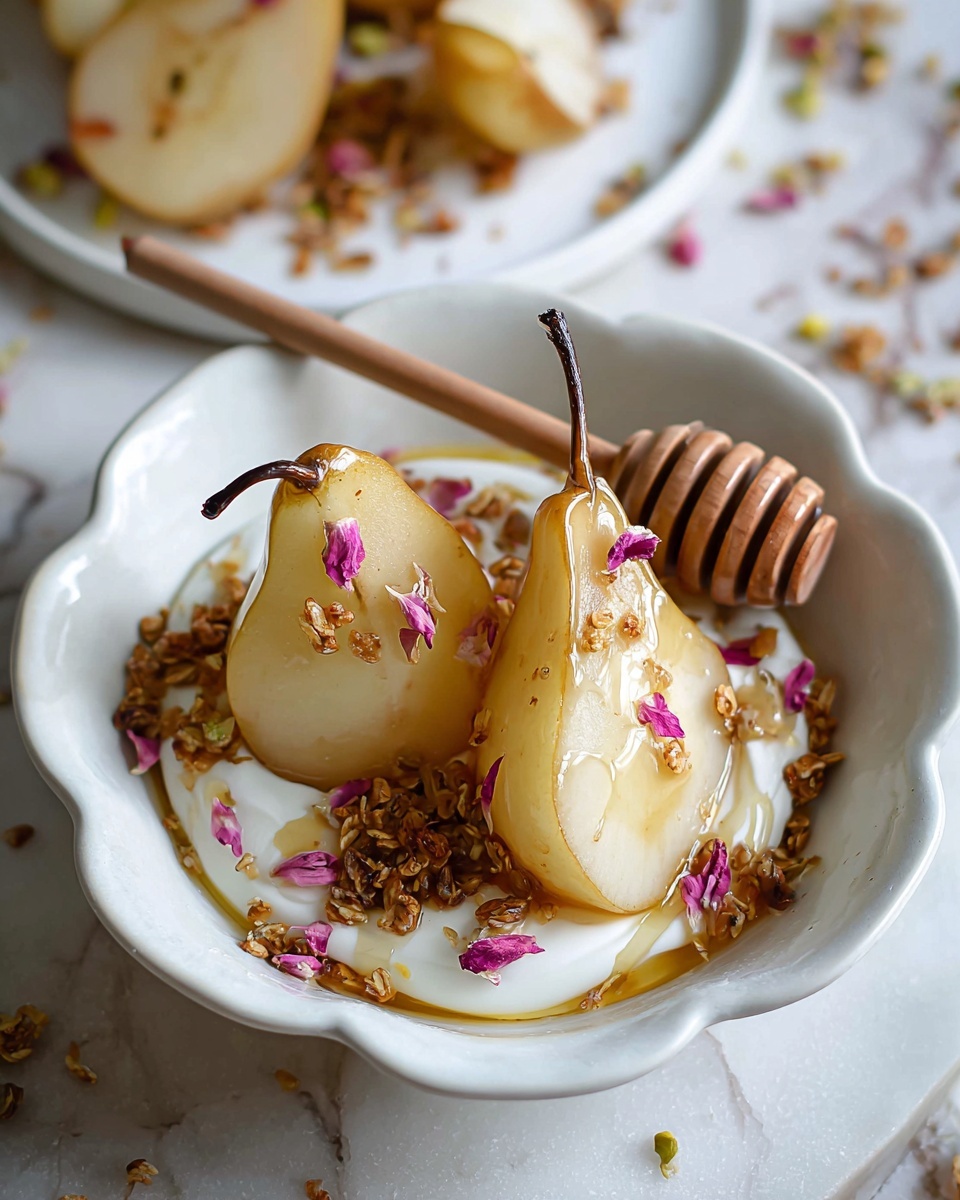 A white scalloped plate on a white marbled surface holds two halves of a soft poached yellow pear with a visible brown stem on one half. The pears rest on a thick, white creamy base, possibly ricotta or yogurt layered evenly covering the plate's bottom. Small brown granola or nut clusters are sprinkled over the pears and creamy base. A wooden honey dipper lies on the right side of the plate with golden honey drizzling over the pears and cream. Part of a white bowl filled with more pears and dried orange slices is blurred in the background. Photo taken with an iphone --ar 4:5 --v 7