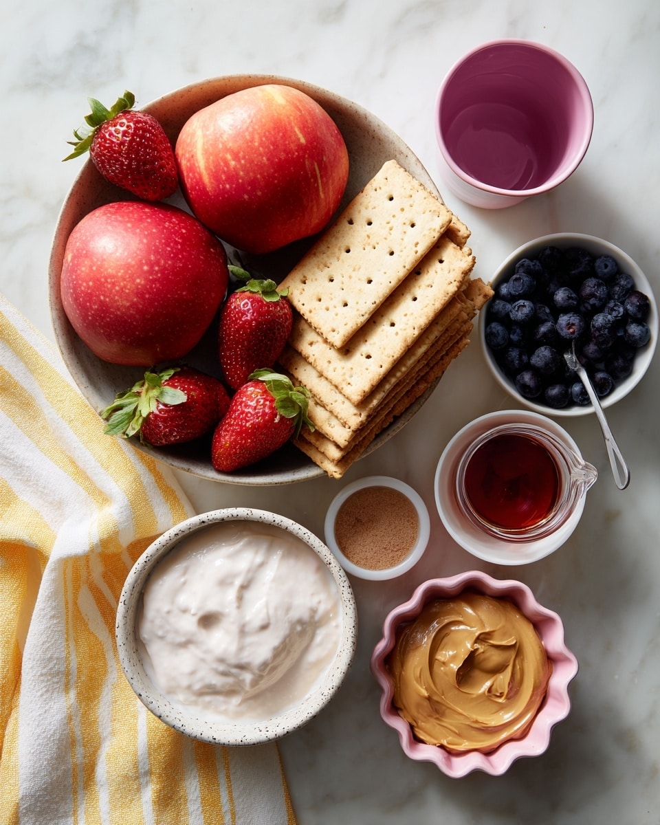 A round bowl holds two bright red apples, several fresh strawberries with green tops, a small pile of dark blue blueberries, and a stack of light brown rectangular crackers with tiny holes. Below the bowl to the left is a white speckled bowl filled with smooth white yogurt. To the right of the bowl are four small containers: a pink cup holding a dark liquid, a small white bowl with light brown powder, a pink scalloped dish with a reddish liquid, and a measuring cup with creamy light brown peanut butter. A yellow and white striped cloth is on the white marbled surface near the bowl. Photo taken with an iphone --ar 4:5 --v 7