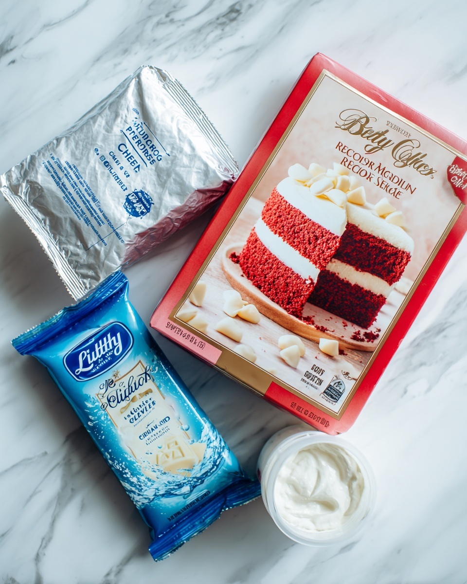 The image shows four baking ingredients placed on a white marbled surface with a white marbled background. On the left is a silver packet of cream cheese, slightly crumpled, with blue text on it. To its right and slightly behind is a bright red and beige box of Betty Crocker Super Moist Red Velvet cake mix, with a picture of a two-layer red velvet cake with white frosting in the center. In front of the cake mix box is a blue and white Lindt Classic Recipe white chocolate bar with golden text and an image of white chocolate pieces splashing into milk. On the right side of the image is a round white container of sugar-free cool whip with a white lid. The items are neatly arranged without overlapping, all resting on the white marbled surface. Photo taken with an iphone --ar 4:5 --v 7