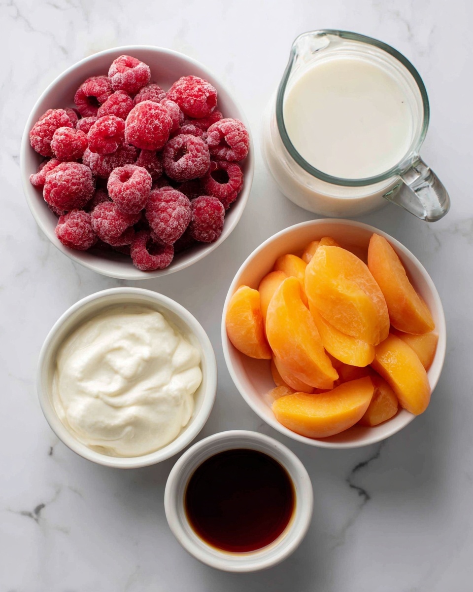 Top-down view of five white bowls and cups on a white marbled surface. Two larger white bowls contain bright red frozen raspberries on the left and bright orange frozen peach slices on the right, both showing a frosty texture. A small white bowl below the raspberries holds creamy white yogurt, smooth and thick. Below the yogurt is a small white cup with a dark brown liquid inside, likely syrup. To the right of the raspberries, a glass pitcher contains white milk with a creamy surface. photo taken with an iphone --ar 4:5 --v 7