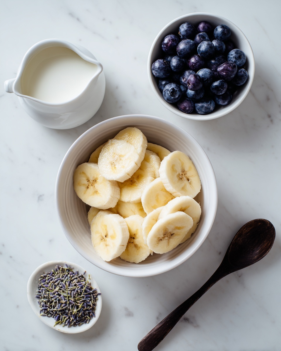 A white bowl in the center holds several pieces of peeled yellow bananas, arranged in layers with a soft texture. To the top left, a small white milk jug sits, filled with white milk. On the top right, a white bowl is full of dark purple blueberries with a smooth surface. At the bottom left, a small white plate contains a small pile of dried lavender, with green and purple colors mixed. To the bottom right, a simple dark wooden spoon lies flat on the white marbled surface. The whole setup is on a white marbled background, and the image is softly lit. photo taken with an iphone --ar 4:5 --v 7