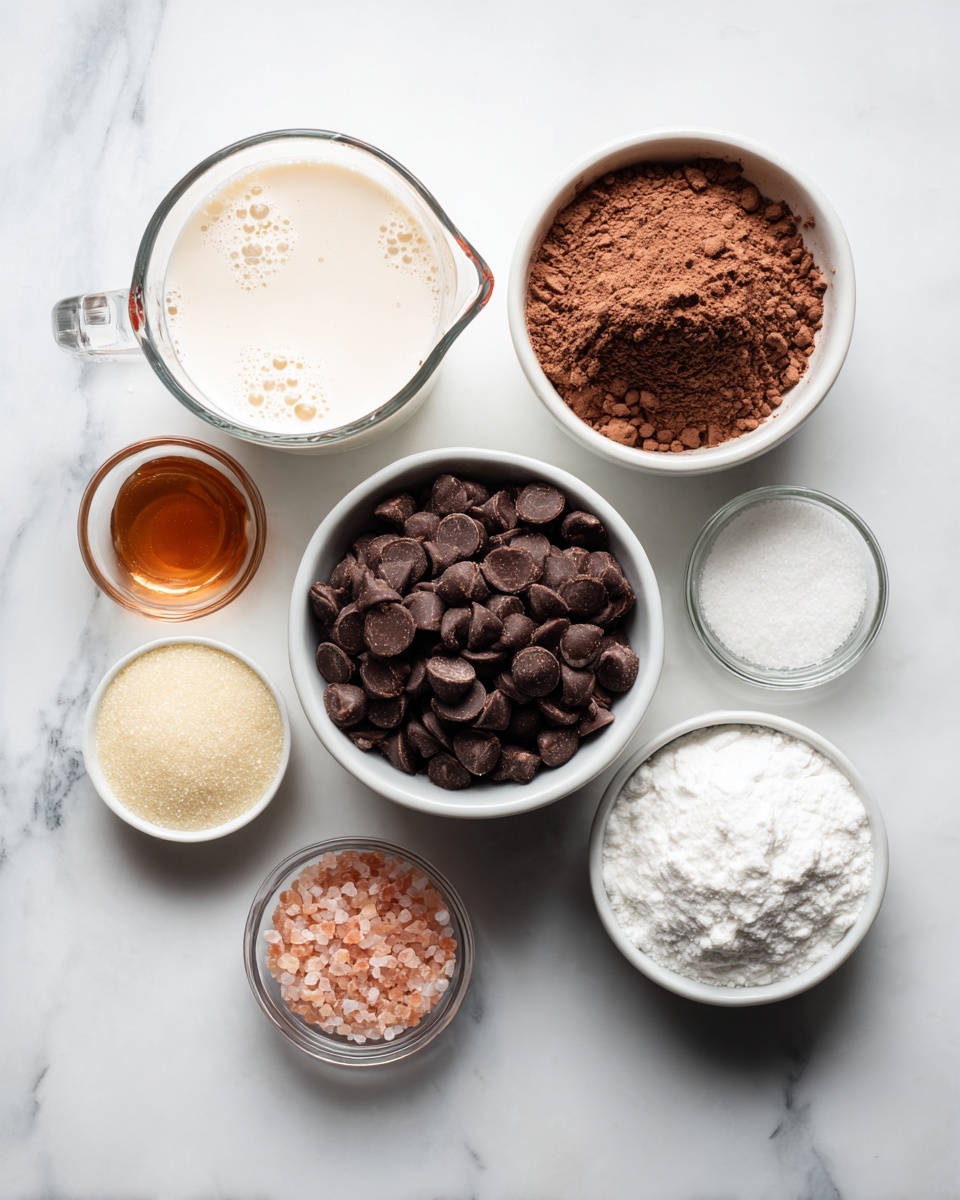 The image shows six small white bowls and one clear glass measuring cup arranged on a white marbled surface. The largest bowl in the center is filled with dark brown chocolate chips, smooth and shiny with a slightly matte finish. Above it, a white bowl holds light brown cocoa powder with a fine, soft texture. To the top left, the glass measuring cup contains a thick cream-colored liquid with small bubbles around the edges. Below the chocolate chips, a white bowl contains light yellow granulated sugar, coarse and sparkly. To the right of the sugar, a white bowl holds a white powder with a fluffy texture. To the right side of the chocolate chips, a small clear glass bowl shows pink salt granules, coarse and grainy. On the far left, a tiny clear glass bowl contains amber-colored liquid syrup, smooth and glossy. All items are carefully placed and well-lit to show texture and color clearly. photo taken with an iphone --ar 4:5 --v 7