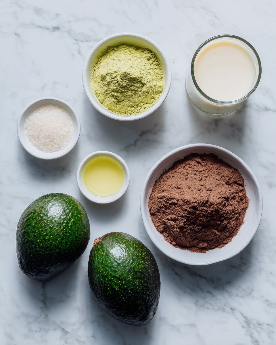 The image shows a white marbled surface with five items arranged neatly: two whole dark green avocados at the bottom, a white bowl filled with a deep brown powder on the right, a transparent glass filled with creamy white liquid on the top right, a small white bowl containing a yellowish liquid on the bottom left, and another small white bowl with a small amount of white granules on the top left. photo taken with an iphone --ar 4:5 --v 7