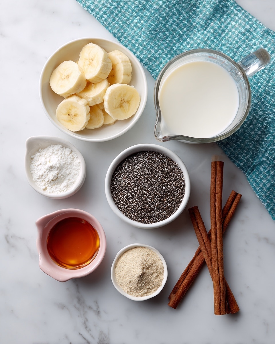 The image shows six main ingredients arranged on a white marbled surface. At the top right, a clear glass measuring cup holds white milk. Below it, a small white bowl contains yellow banana slices cut into thick pieces. To the right of the bananas, a small white bowl is filled with tiny black chia seeds. On the left side, a white measuring cup has white collagen powder, and below it a small pink measuring cup contains dark amber maple syrup. At the bottom middle, a small container holds beige vanilla powder, and next to it, two brown cinnamon sticks lay crossed. A teal and white checkered cloth is placed toward the top left corner. photo taken with an iphone --ar 4:5 --v 7