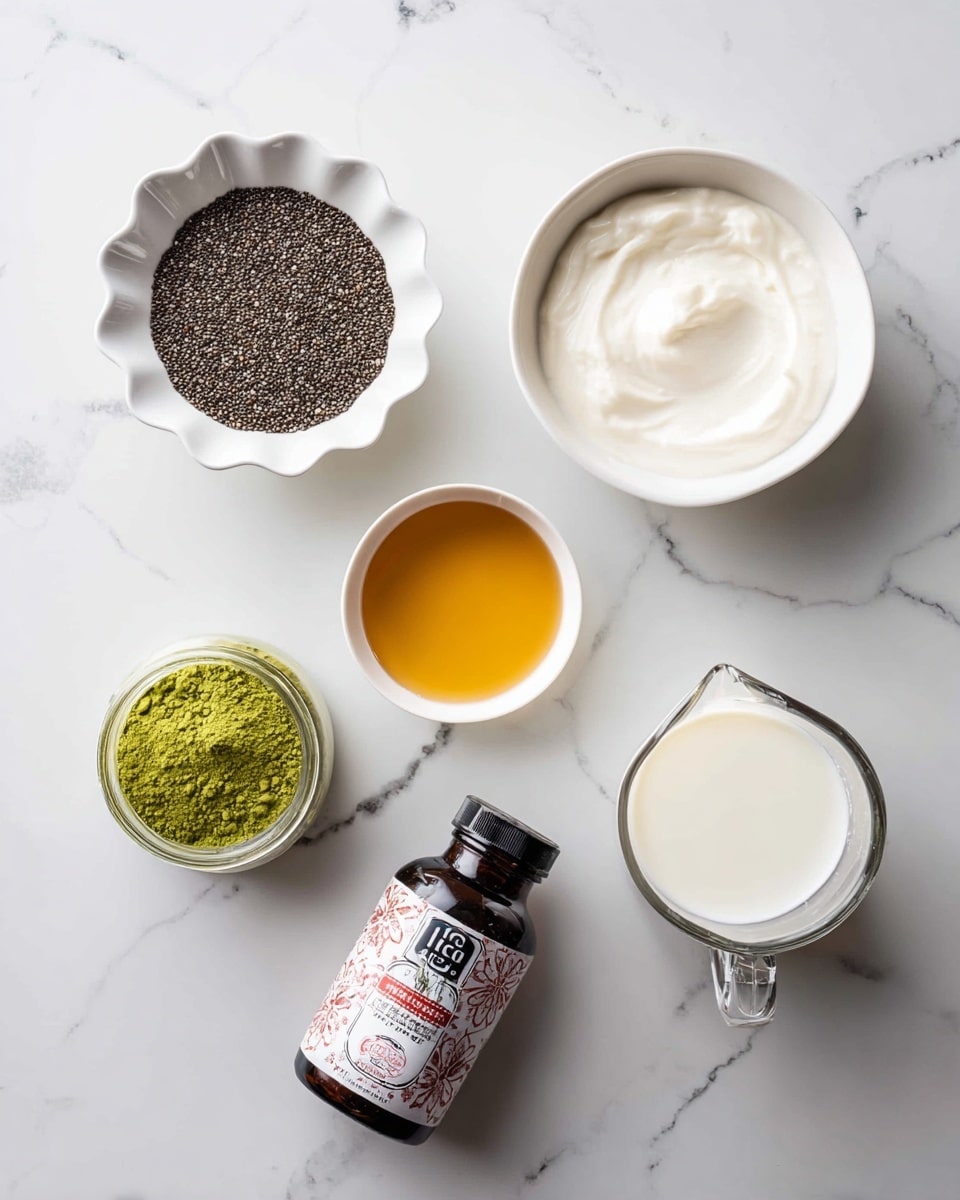 Several small white bowls and a clear measuring cup are arranged on a white marbled surface. One bowl holds small black chia seeds, another has a creamy white thick yogurt, and a third small bowl contains a light yellow liquid similar to honey or syrup. A small black bottle with a red label, likely vanilla extract, lies near the center. Two small open containers show powders, one dark green and the other bright green. The clear measuring cup is filled with white milk. The overall scene is neat and ready for mixing ingredients. photo taken with an iphone --ar 4:5 --v 7