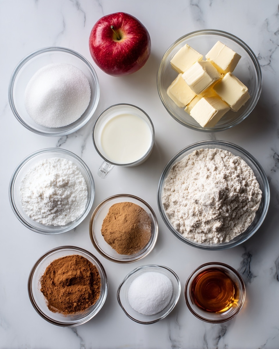 The image shows nine clear glass bowls and one clear glass cup arranged on a white marbled surface. At the top left is a red apple beside a bowl of white sugar, to its right is a bowl with two pats of light yellow butter, and next to that is a glass cup half full of milk. Below these are a small bowl of light brown sugar at the center and a larger bowl of white flour on the right. Toward the bottom left are oval bowls containing white salt, brown cinnamon powder, white baking powder, and amber-colored vanilla extract, arranged in a diagonal line. The bowls and cup hold dry and wet baking ingredients neatly separated, all on a white marbled surface, photo taken with an iphone --ar 4:5 --v 7