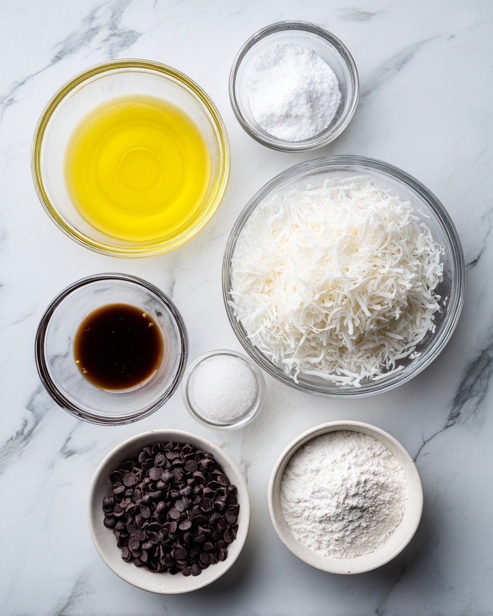 The image shows six clear glass bowls with different ingredients arranged on a white marbled surface. At the top left, there is a bowl with a yellow, liquid ingredient, likely egg whites or oil. To the right of it, a smaller bowl holds a white powder, possibly salt. Below the salt bowl, a slightly bigger bowl contains a dark brown liquid, which looks like vanilla extract. In the center, the largest bowl is filled with white shredded coconut. To the left of the coconut, there is a bowl holding white flour, and below it, a 1-cup white bowl is filled with dark chocolate chips. At the bottom right, there is a small bowl filled with white granulated sugar. photo taken with an iphone --ar 4:5 --v 7