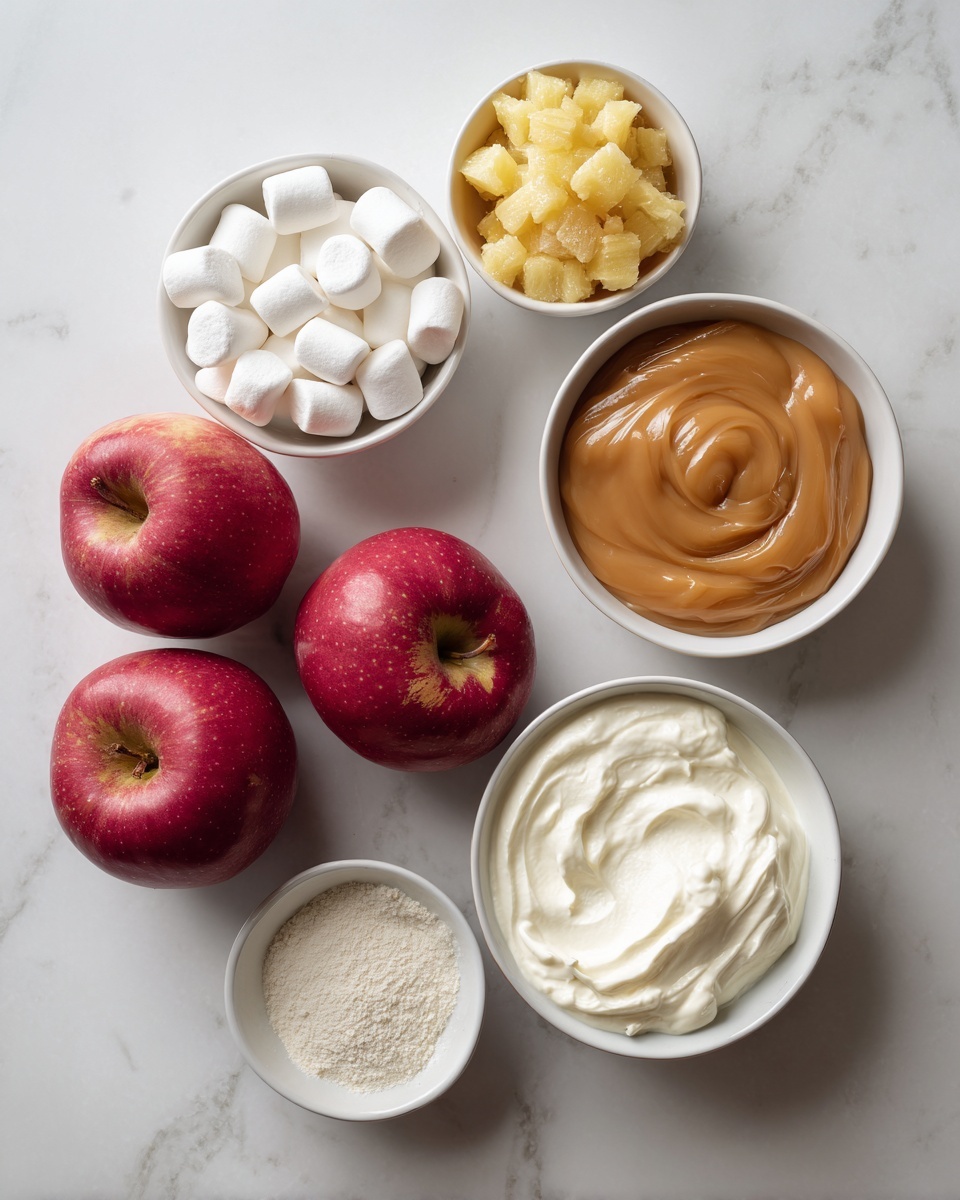 The image shows three red apples at the bottom on a white marbled surface. Above them, there are five small white bowls arranged in a loose cluster. The top left bowl is filled with small white marshmallows, the top right bowl holds a chunky yellow mixture that looks like crushed pineapple, below the marshmallows is a bowl with smooth, thick caramel sauce, next to it on the right is a bowl of white creamy substance resembling whipped cream, and below the caramel sauce bowl is a smaller bowl filled with fine white powder, likely sugar or flour. Everything is displayed neatly on the white marbled surface, with soft natural light highlighting the textures and colors. photo taken with an iphone --ar 4:5 --v 7