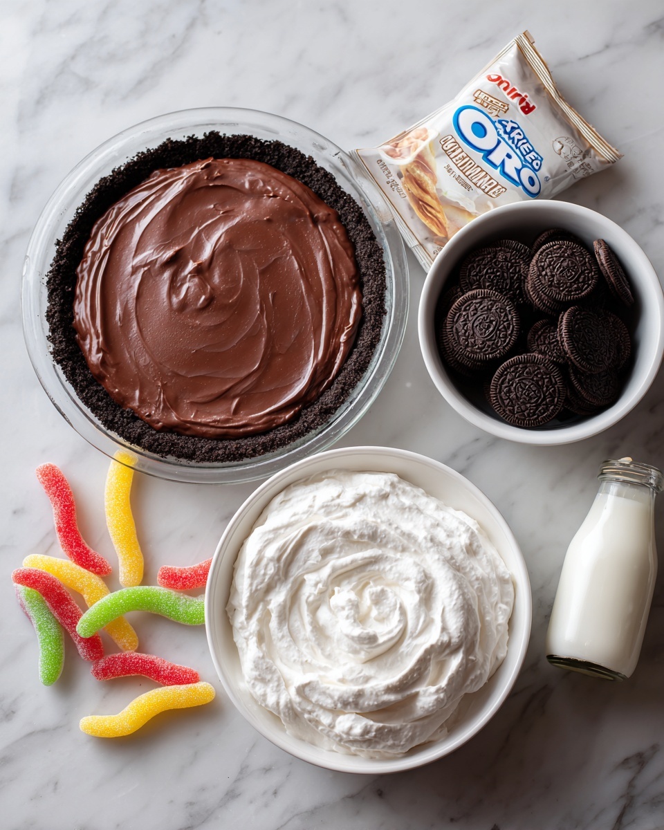 The image shows ingredients for a dessert arranged on a white marbled surface. There is a glass pie dish filled with a dark brown smooth Oreo pie crust on the left side. To the right, a small white bowl filled with whole Oreos sits near a pale brown packet of chocolate pudding mix. In the center bottom area, a white bowl holds a thick layer of white Cool Whip with a creamy texture. Scattered around are colorful gummy worms with red, yellow, and green hues adding a playful touch. A small clear glass bottle filled with milk is also present near the bottom right. The scene has a clean and organized look. photo taken with an iphone --ar 4:5 --v 7