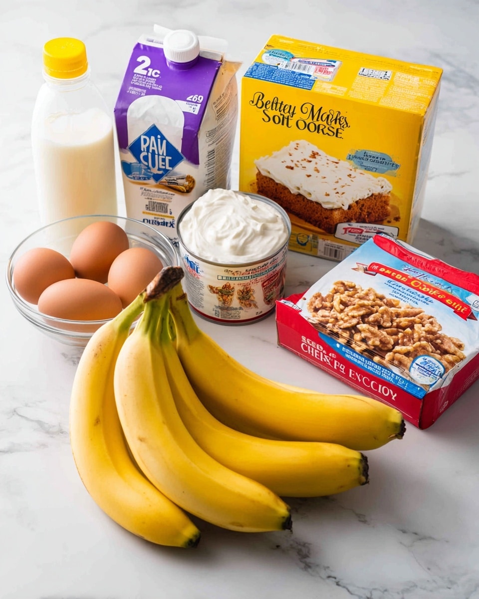 In this image, there is a bunch of ripe yellow bananas with some brown spots placed in the front center on a white marbled surface. To the left of the bananas, there is a clear glass bowl with three brown eggs. Behind the eggs, there is a purple and white carton of 2% milk. Next to the milk is a bottle of clear vegetable oil with a yellow cap. Beside the oil bottle is a can of condensed milk with a white label. On the right side of the bananas, there is a red and white container of whipped cream cheese in front of a box of Betty Crocker Super Moist Golden cake mix with a yellow and red design and an image of a cake on the front. To the right of the cake box, there is a white box of cream cheese with an image of a cheesecake slice. Lastly, there is a bag of chopped walnuts which is yellow with blue text on the far right. The ingredients are displayed on a white marbled countertop with a subtle pattern visible, and the photo was taken with an iphone --ar 4:5 --v 7